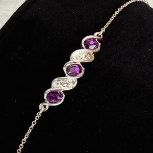 Beautiful Silvertone, purole and clear bling adjustable bracelet